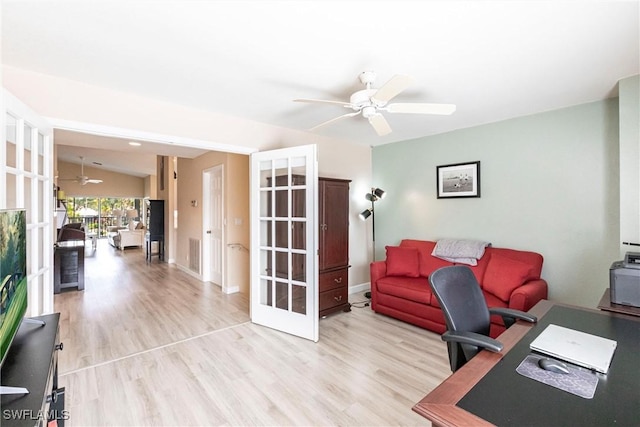 office area with a ceiling fan, baseboards, visible vents, french doors, and light wood-type flooring