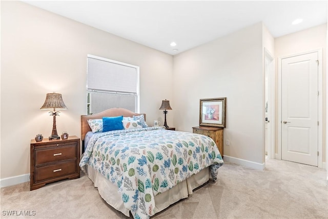 bedroom with light carpet