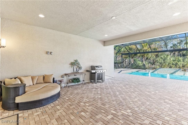 interior space with a grill, a lanai, and an outdoor living space