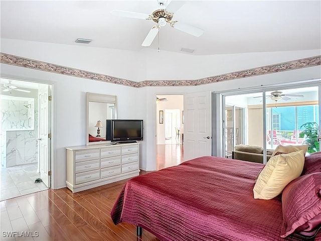 bedroom with lofted ceiling, access to exterior, visible vents, and wood finished floors