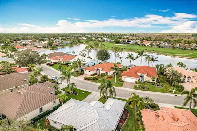 birds eye view of property featuring a water view and a residential view