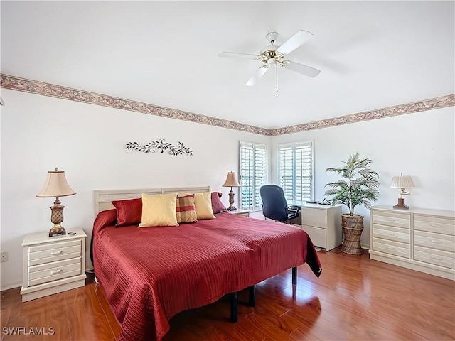 bedroom featuring wood finished floors and a ceiling fan