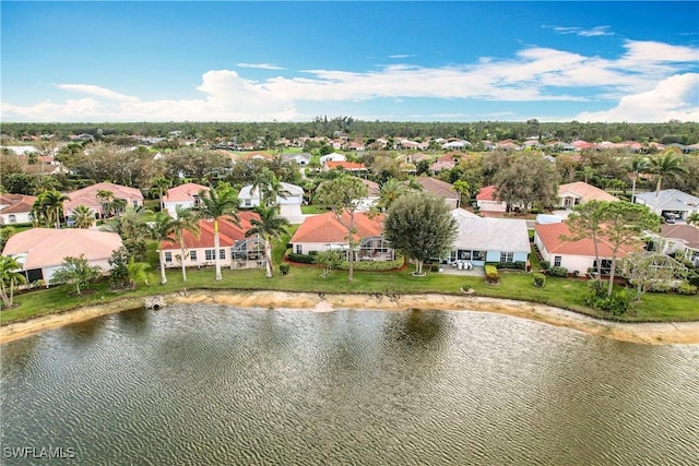 aerial view featuring a water view and a residential view