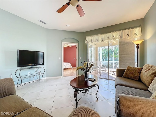 tiled living room featuring ceiling fan