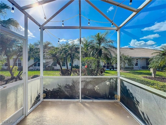 unfurnished sunroom with vaulted ceiling