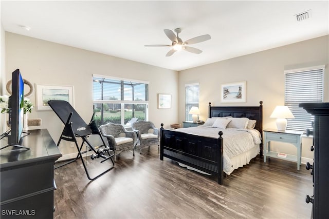 bedroom featuring dark hardwood / wood-style floors and ceiling fan