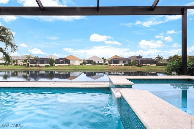 view of pool with a water view and pool water feature