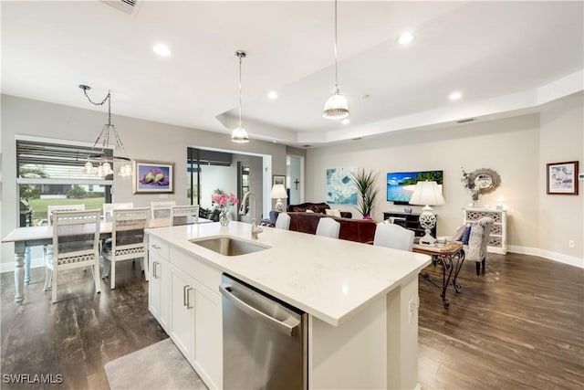 kitchen featuring pendant lighting, sink, white cabinetry, a center island with sink, and stainless steel dishwasher