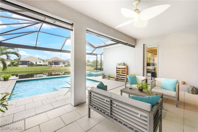 view of pool with ceiling fan and a water view