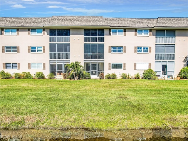 view of building exterior with a water view