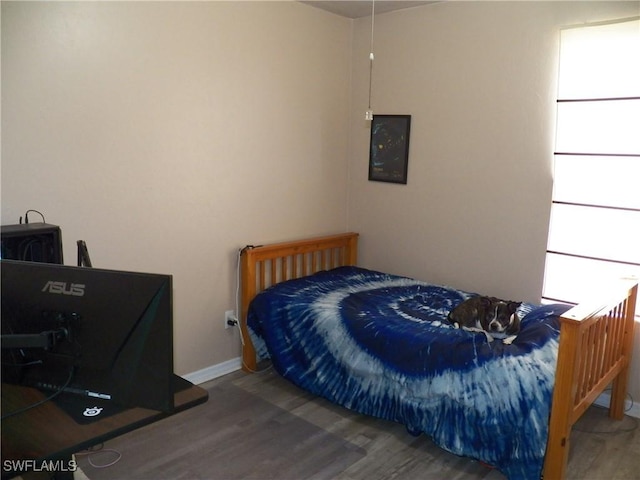 bedroom featuring wood-type flooring