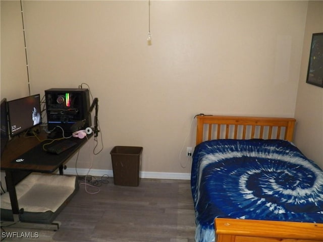 bedroom featuring dark hardwood / wood-style flooring