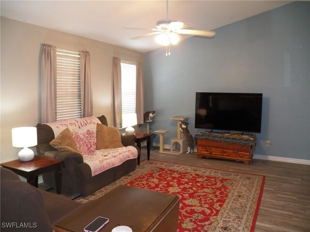 living room with ceiling fan and hardwood / wood-style floors