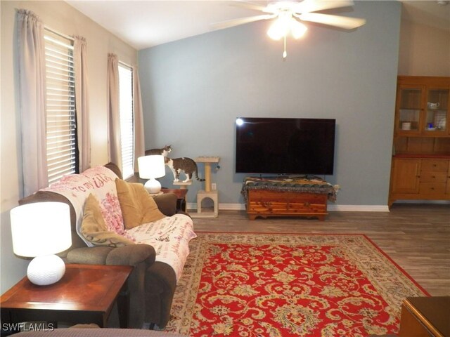 living room featuring ceiling fan, lofted ceiling, and hardwood / wood-style floors