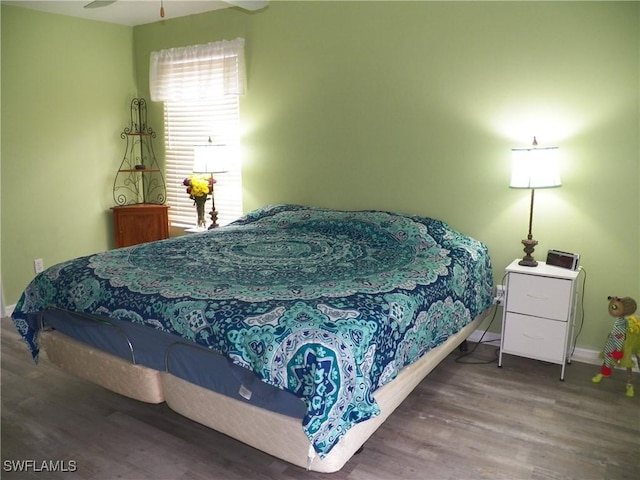 bedroom featuring ceiling fan and wood-type flooring