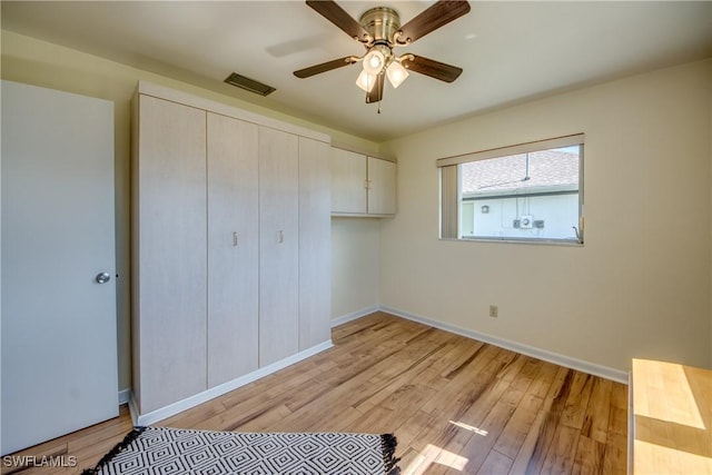 bedroom featuring a closet, ceiling fan, and light wood-type flooring