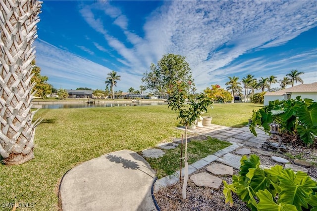 view of yard with a patio area and a water view