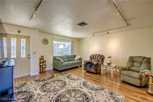 living room featuring track lighting and light wood-type flooring