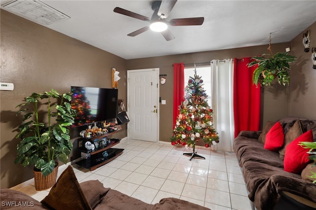 living room with ceiling fan and light tile patterned floors