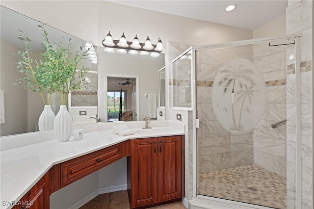 bathroom with tile patterned floors, an enclosed shower, and vanity