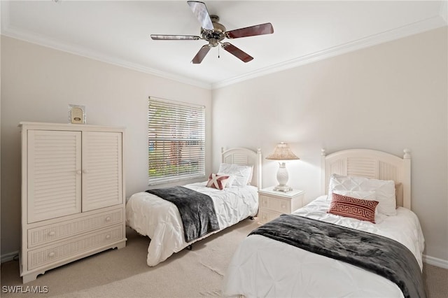 bedroom featuring ceiling fan, crown molding, and carpet floors