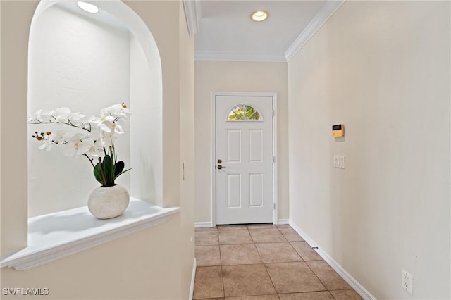 tiled entrance foyer with ornamental molding