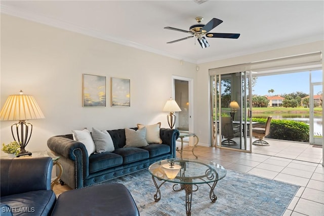 living room with ceiling fan, light tile patterned flooring, and ornamental molding