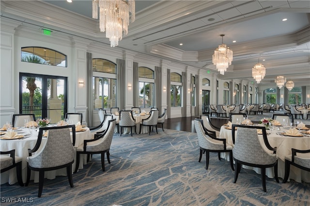 dining space with crown molding and a chandelier