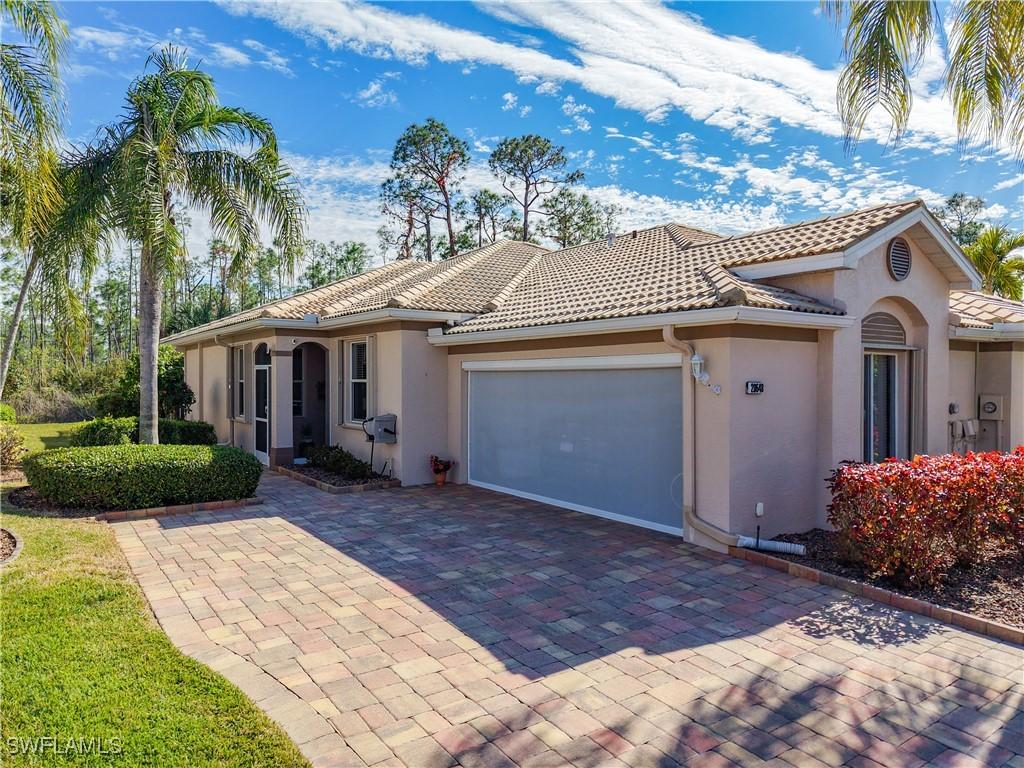 mediterranean / spanish-style home featuring a garage