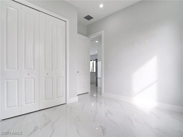 unfurnished bedroom with a closet