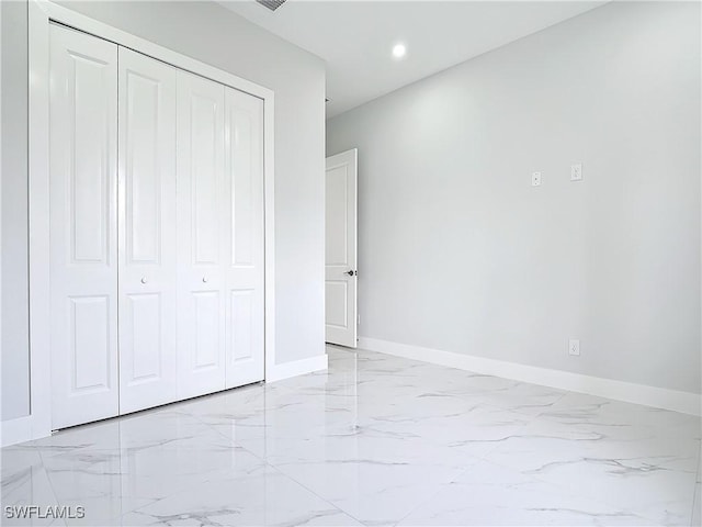 unfurnished bedroom with a closet