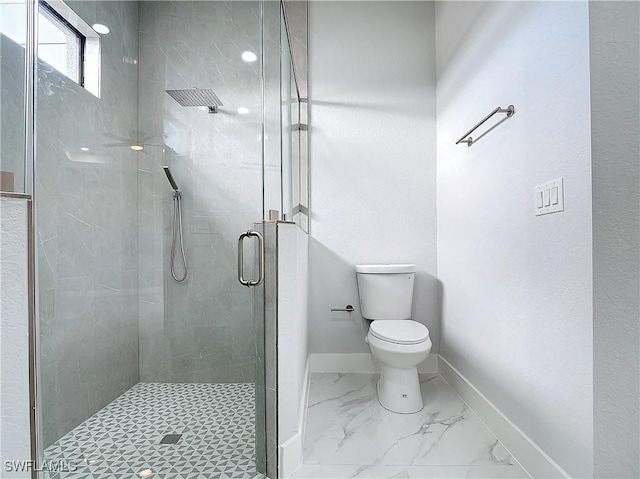 bathroom with an enclosed shower and toilet