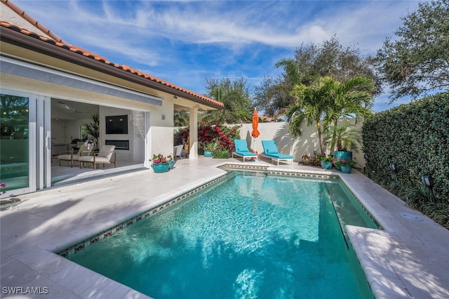 view of swimming pool featuring a patio