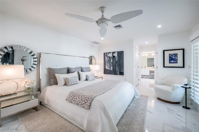 bedroom featuring ceiling fan and connected bathroom