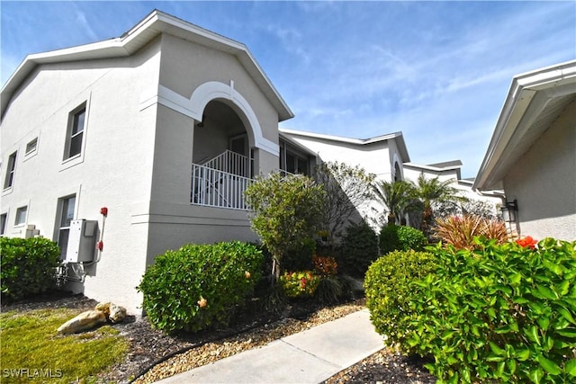 view of property exterior with a balcony