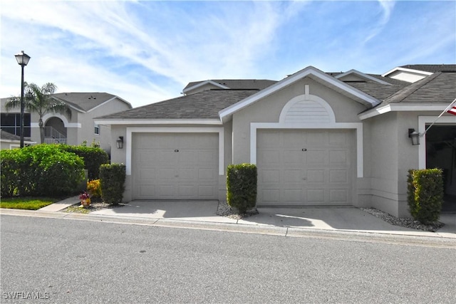 ranch-style home featuring a garage