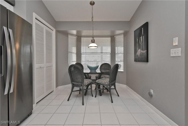 dining area with light tile patterned flooring