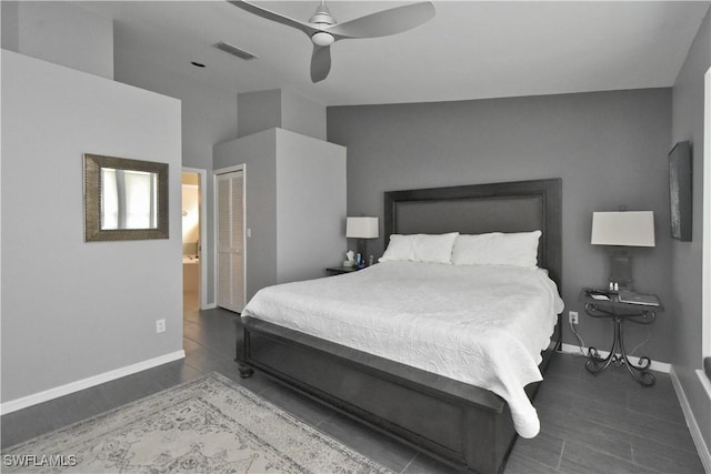 bedroom with ceiling fan, a closet, and ensuite bath