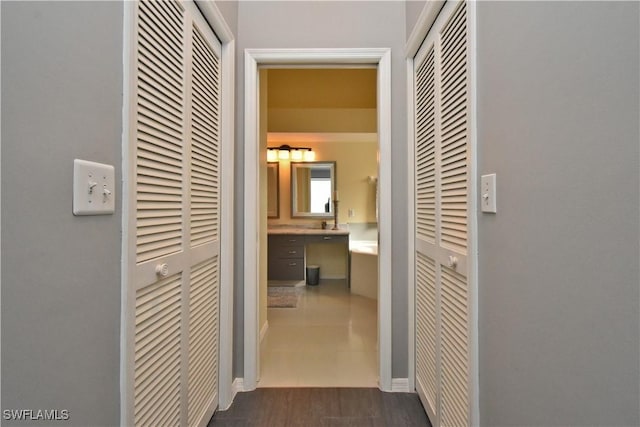 corridor featuring dark hardwood / wood-style floors