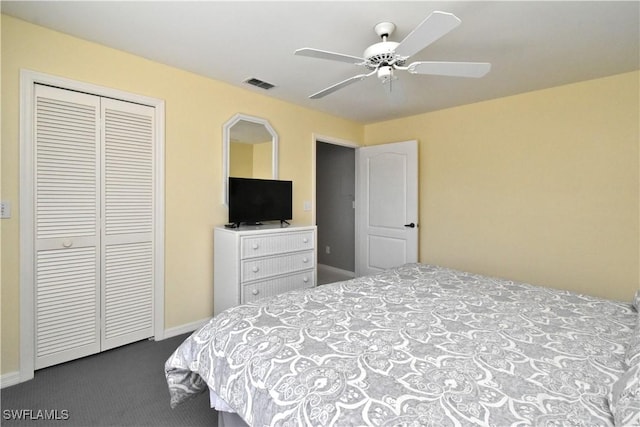 bedroom with ceiling fan, a closet, and carpet flooring