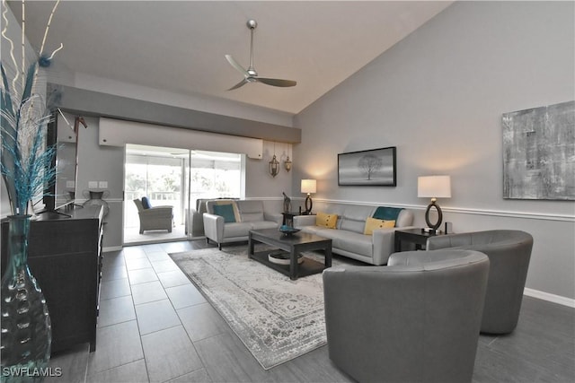 tiled living room featuring ceiling fan and high vaulted ceiling