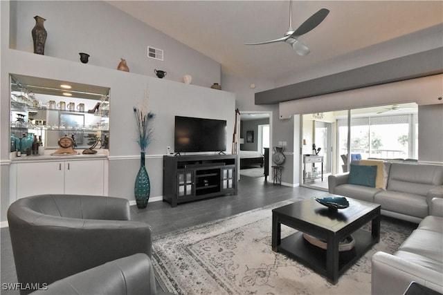 living room with ceiling fan, wood-type flooring, and high vaulted ceiling