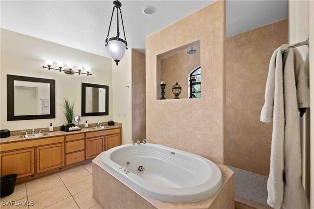 106 SE 5th St, Cape Coral, FL 33990 - full bath with a whirlpool tub, tile patterned floors, double vanity, tile walls, and walk in shower