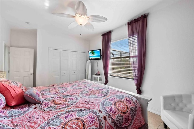 106 SE 5th St, Cape Coral, FL 33990 - bedroom with a closet, a ceiling fan, baseboards, and light tile patterned floors