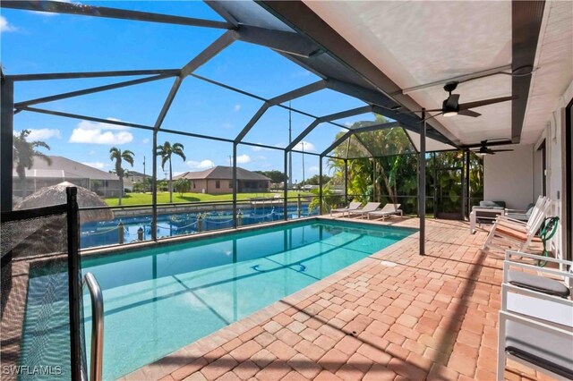 106 SE 5th St, Cape Coral, FL 33990 - swimming pool with a patio, a ceiling fan, and glass enclosure
