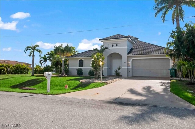 106 SE 5th St, Cape Coral, FL 33990 - mediterranean / spanish-style house featuring a garage, a front yard, driveway, stucco siding, and a tile roof