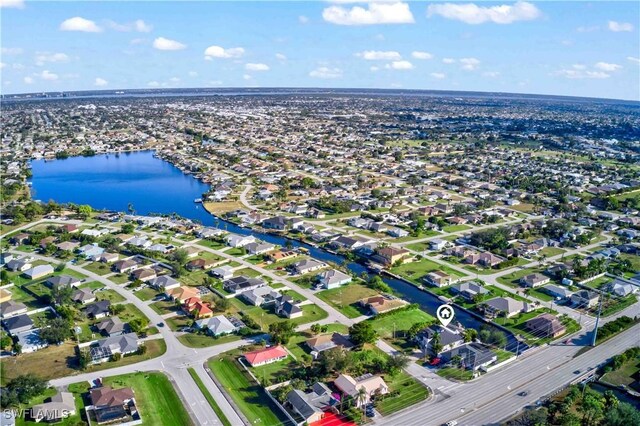 106 SE 5th St, Cape Coral, FL 33990 - aerial overview of property's location featuring a nearby body of water and nearby suburban area