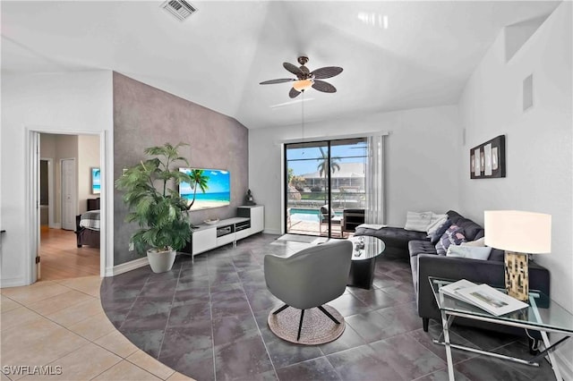 106 SE 5th St, Cape Coral, FL 33990 - tiled living room featuring ceiling fan, vaulted ceiling, and baseboards
