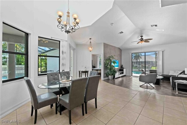 106 SE 5th St, Cape Coral, FL 33990 - tiled dining room with lofted ceiling, a chandelier, ceiling fan, and baseboards
