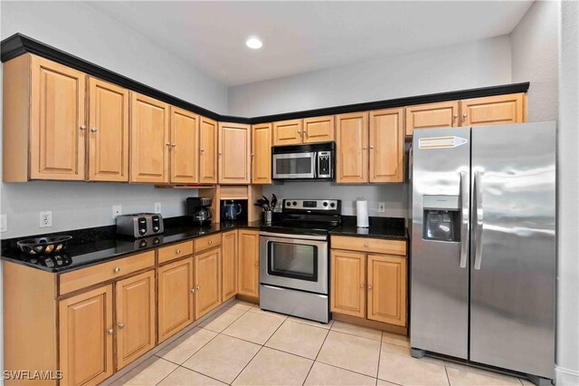 106 SE 5th St, Cape Coral, FL 33990 - kitchen with appliances with stainless steel finishes, light tile patterned floors, and recessed lighting